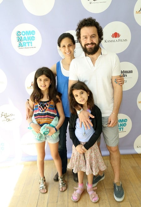 A picture of Max Casella with his wife and daughters.